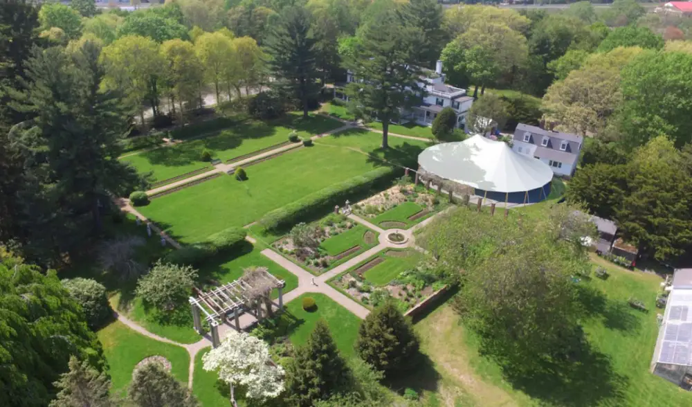 Aerial view of the gardens, tent and mansion